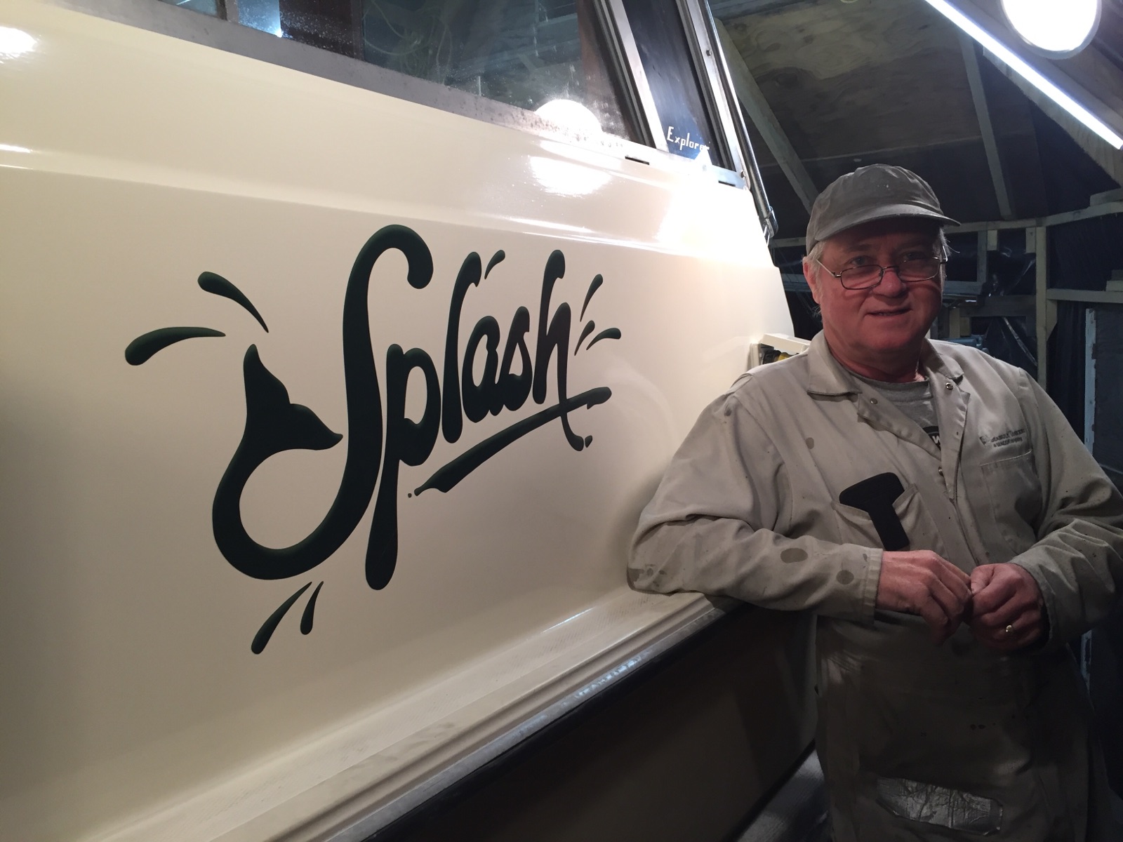 [Photo: Dad with Splash graphic on his boat]