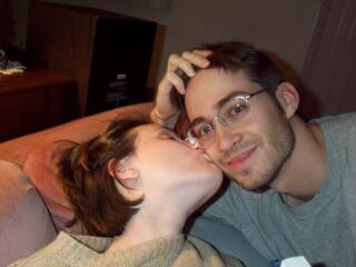 Picture of Jeanie kissing Dave, both with new short haircuts
